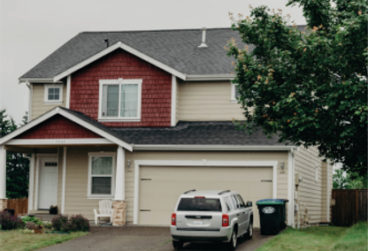 Exterior shot of a house with a car parked in the driveway