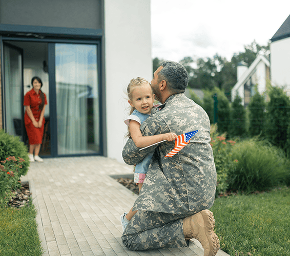 child hugging her father